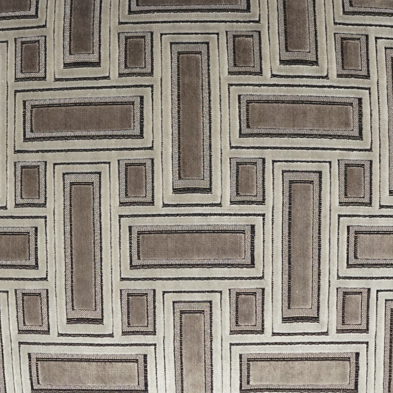 Geometric rectangle-patterned upholstery fabric in taupe, brown and beige tones; woven textile for sofas.