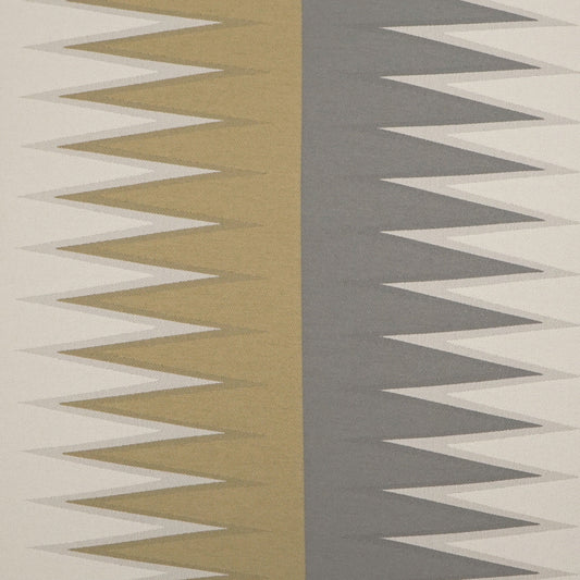 Two-tone zigzag chevron fabric: gold left panel and gray right panel on cream/beige backdrop.