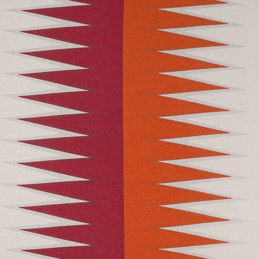Fabric with bold magenta and orange zigzag panels on a cream background