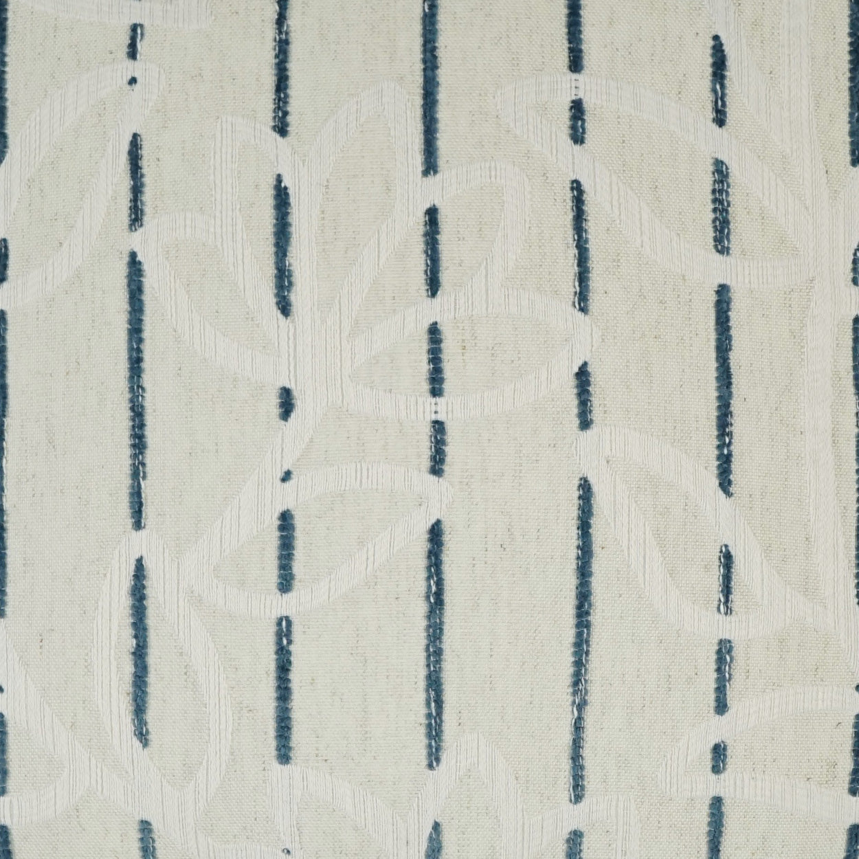 Cream woven fabric with navy vertical stripes and white embroidered leaf-vine pattern; versatile upholstery material.