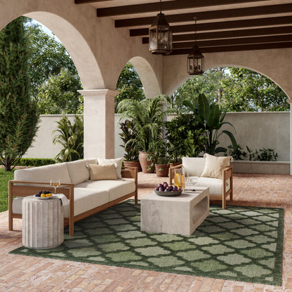 Green lattice rug on a Mediterranean-style patio.