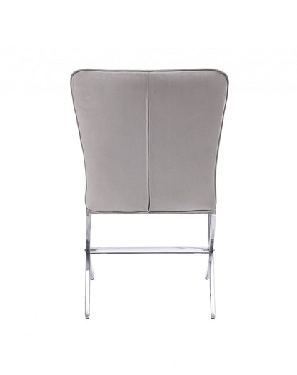 24-inch beige and silver velvet Parsons chair.