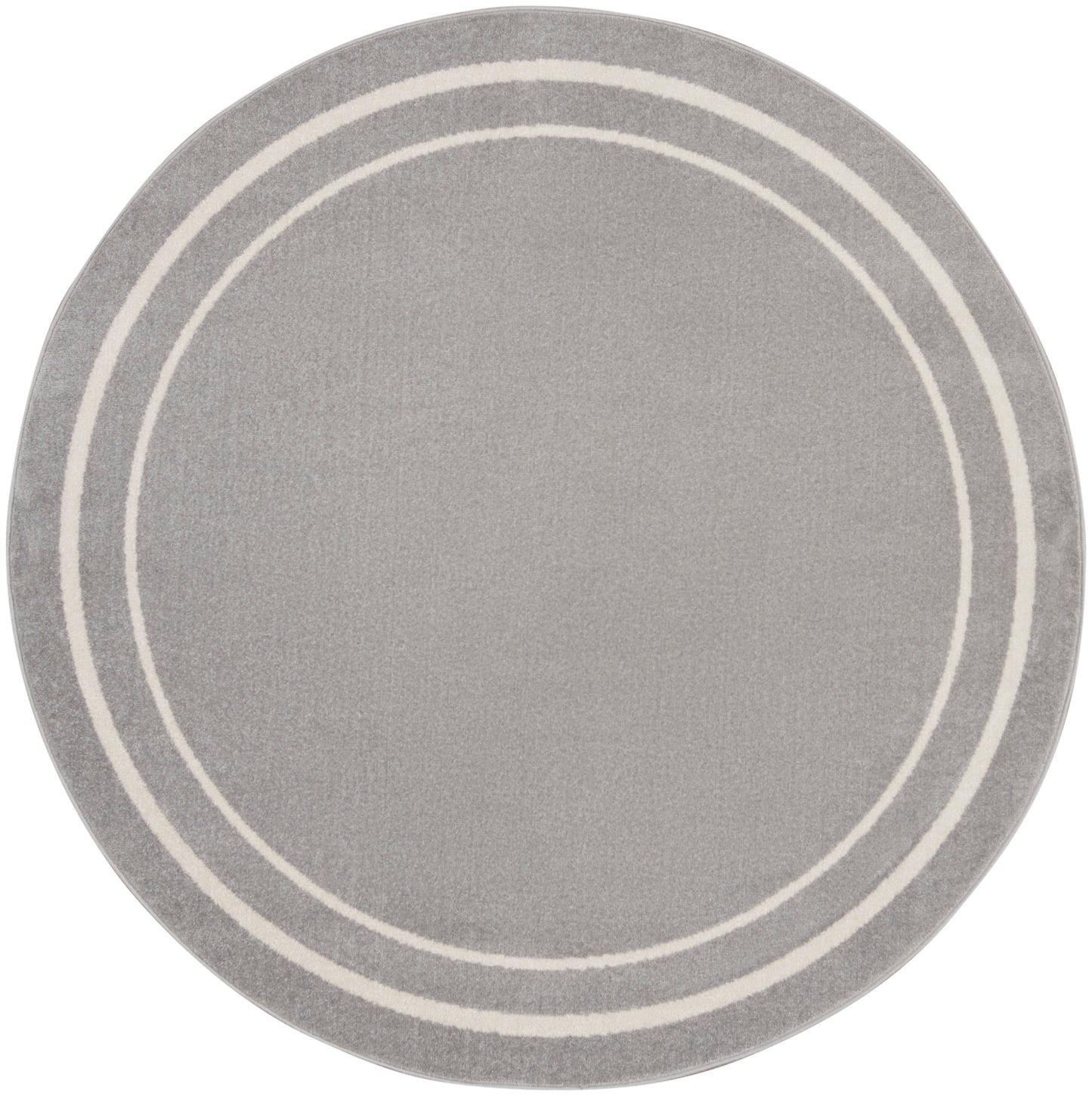 Round grey rug featuring two white concentric rings along the border; soft textured surface.