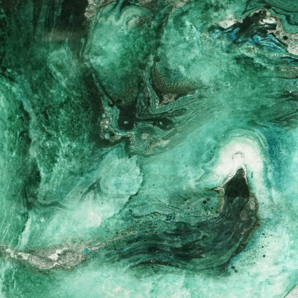 Emerald green marbled fabric with turquoise swirls and white accents.