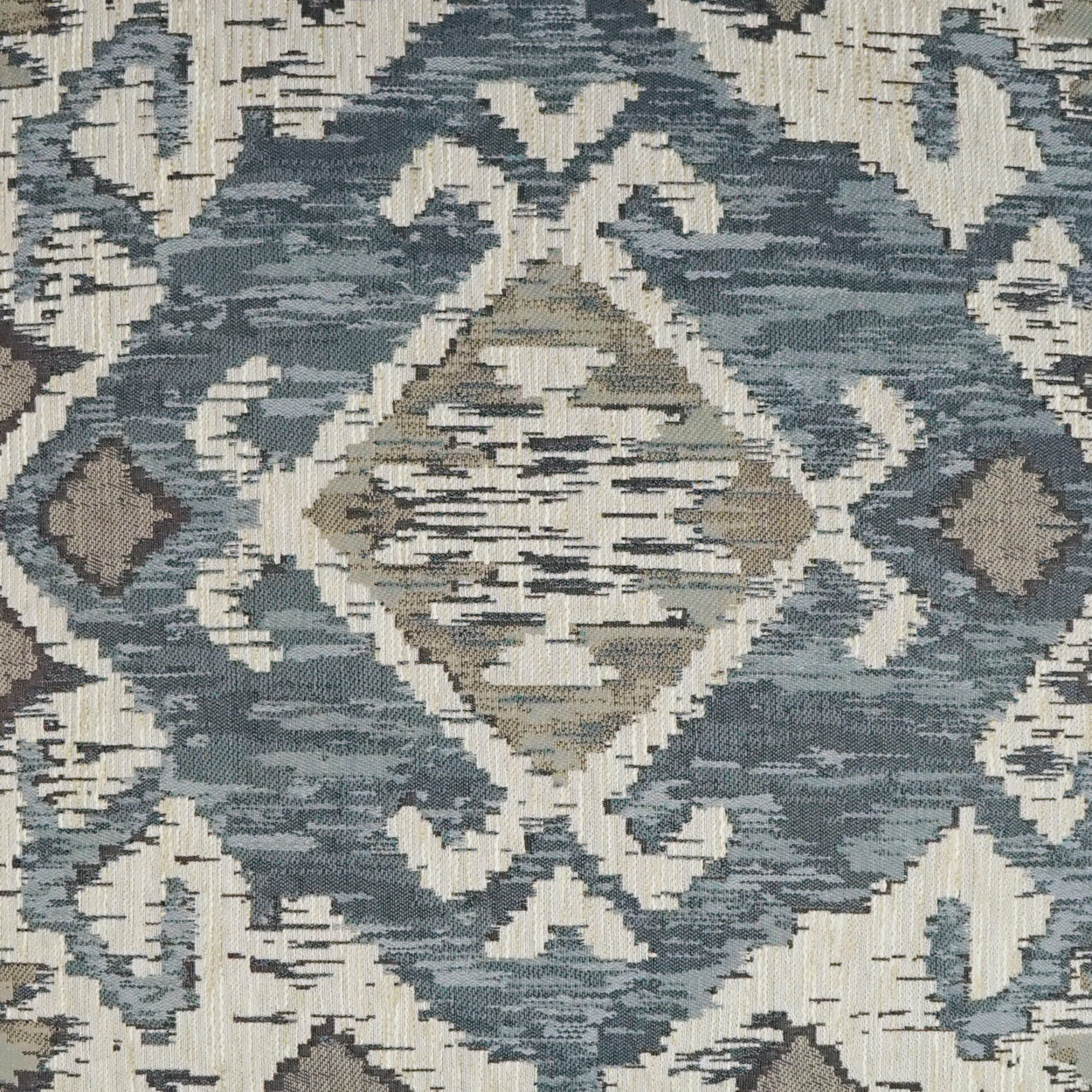 Blue-gray and ivory geometric ikat pattern woven fabric with diamond motifs; decorative textile.