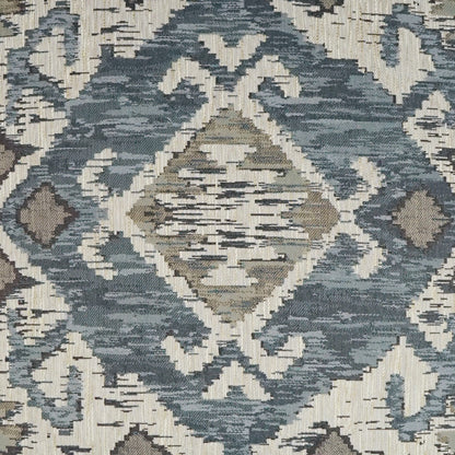 Blue-gray and ivory geometric ikat pattern woven fabric with diamond motifs; decorative textile.