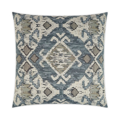 Square woven pillow in blue, ivory and taupe with ikat-inspired geometric diamond pattern.