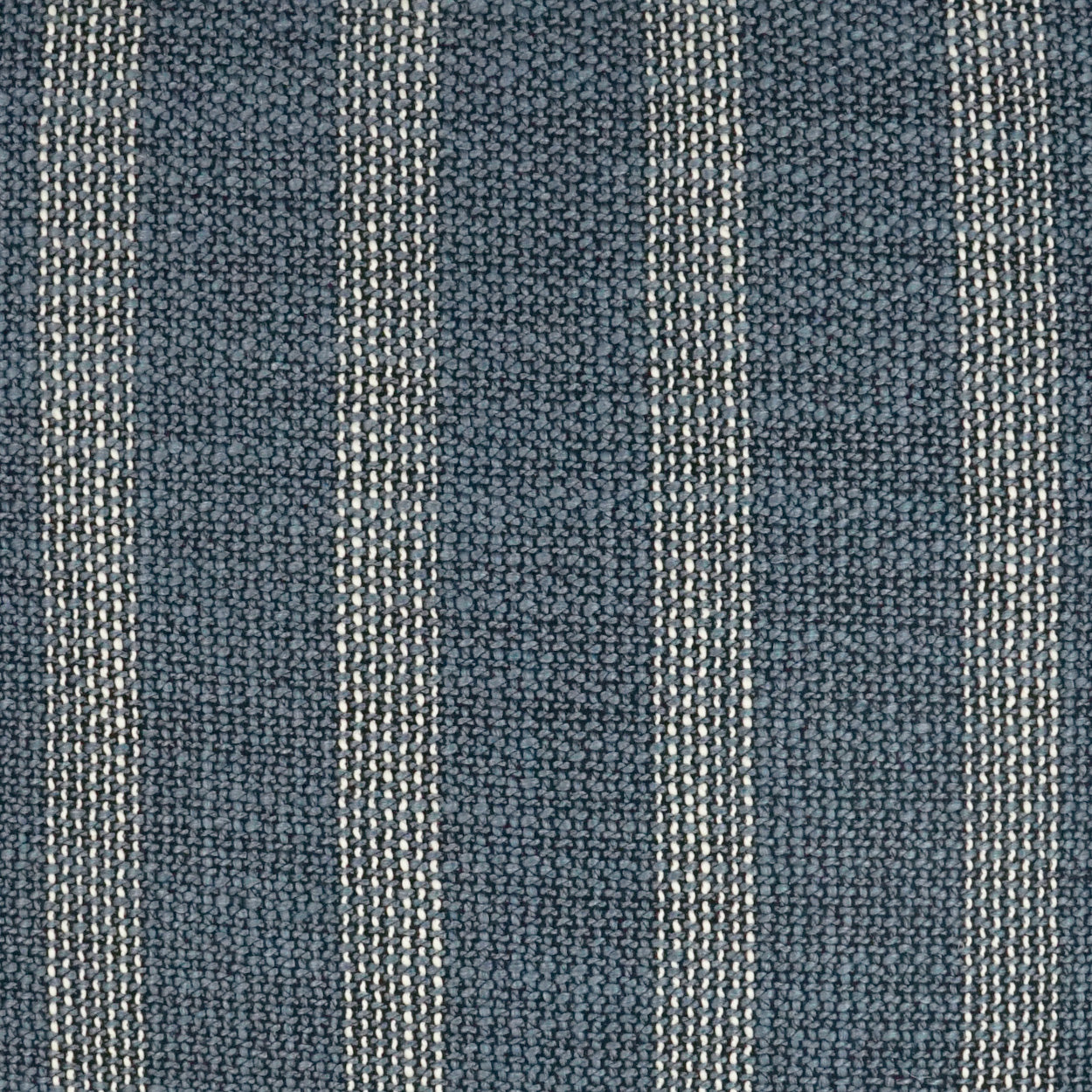 Dark blue woven fabric with vertical white pinstripes, textured upholstery textile.