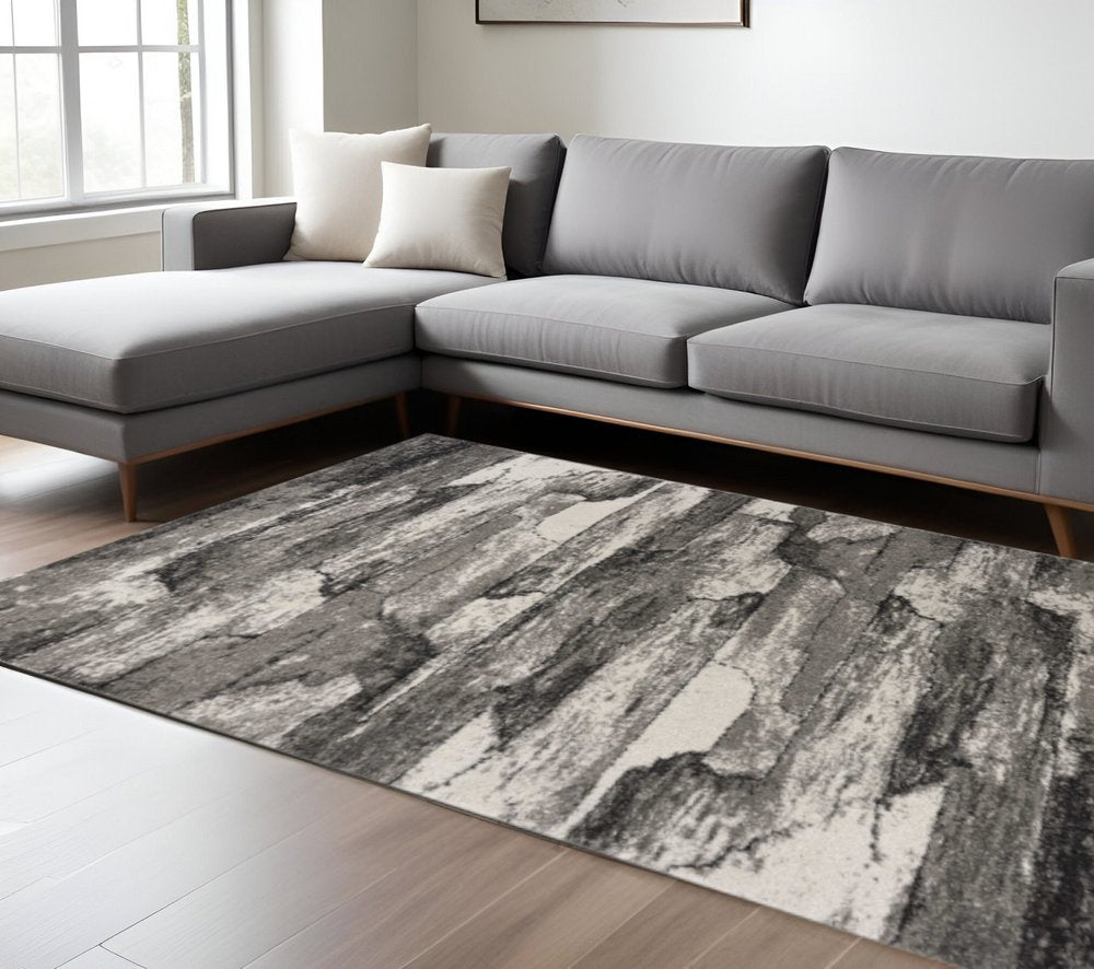 Gray abstract area rug, 8' x 11'.