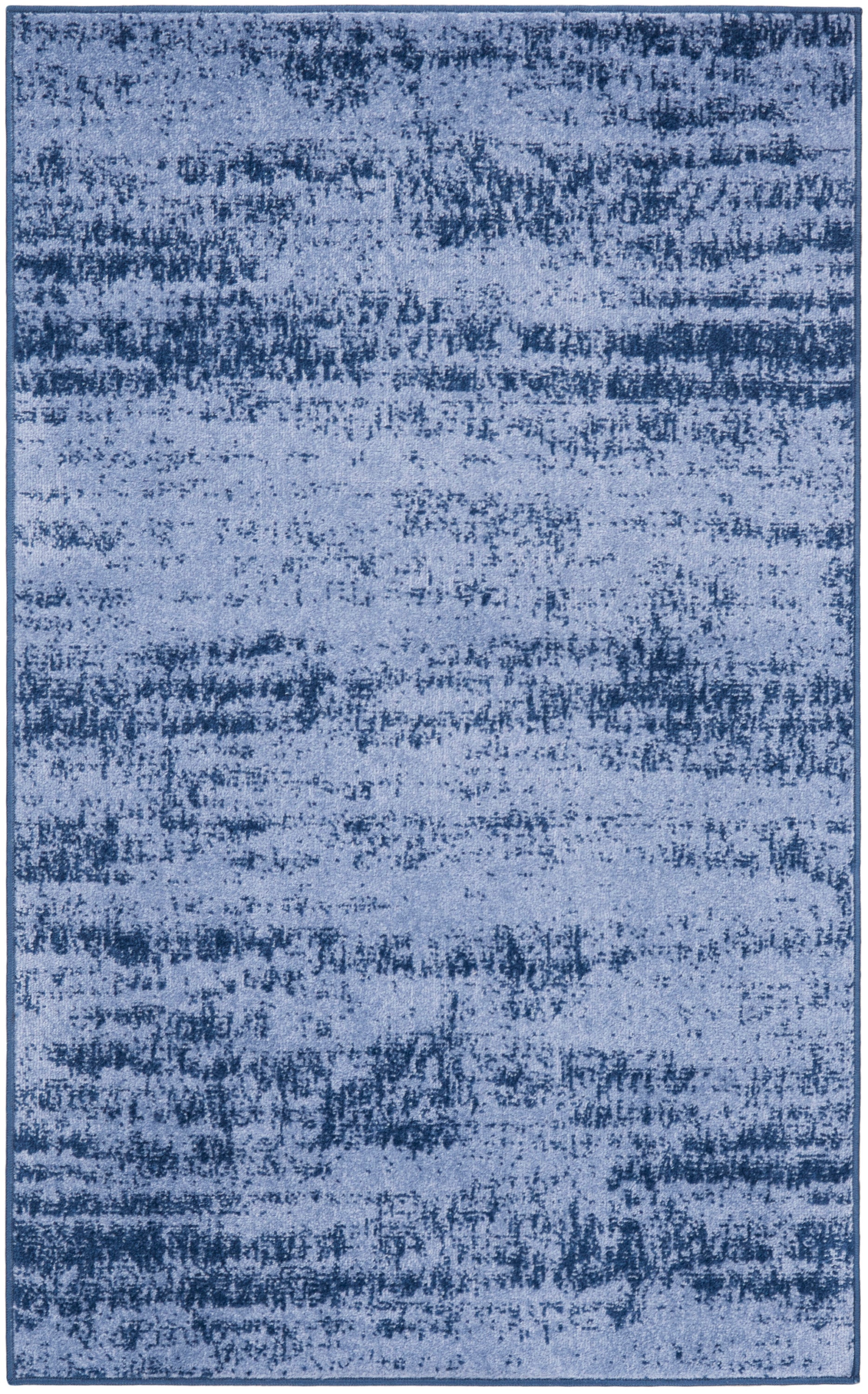 Rectangular blue rug with an abstract distressed pattern and dark border; soft-pile, modern decor.