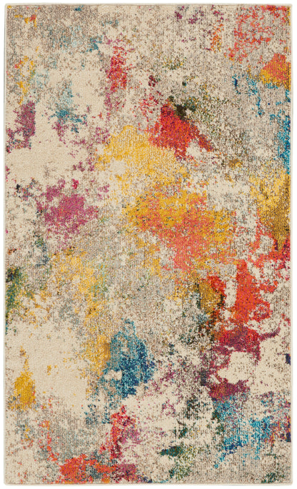 Abstract multicolor area rug with beige base and vibrant splashes of yellow, red, blue, teal, and pink.