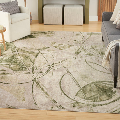 Living room featuring a beige-green abstract botanical rug, white armchair, gray sofa, beige ottomans, and wooden floor.