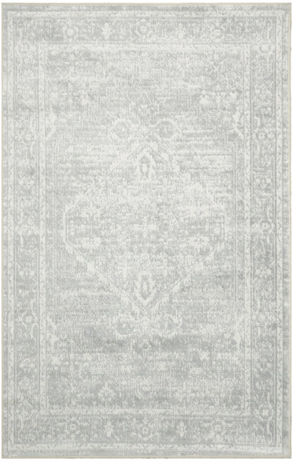Light gray distressed rug with subtle Persian-inspired medallion and ornate border in vintage faded tones.