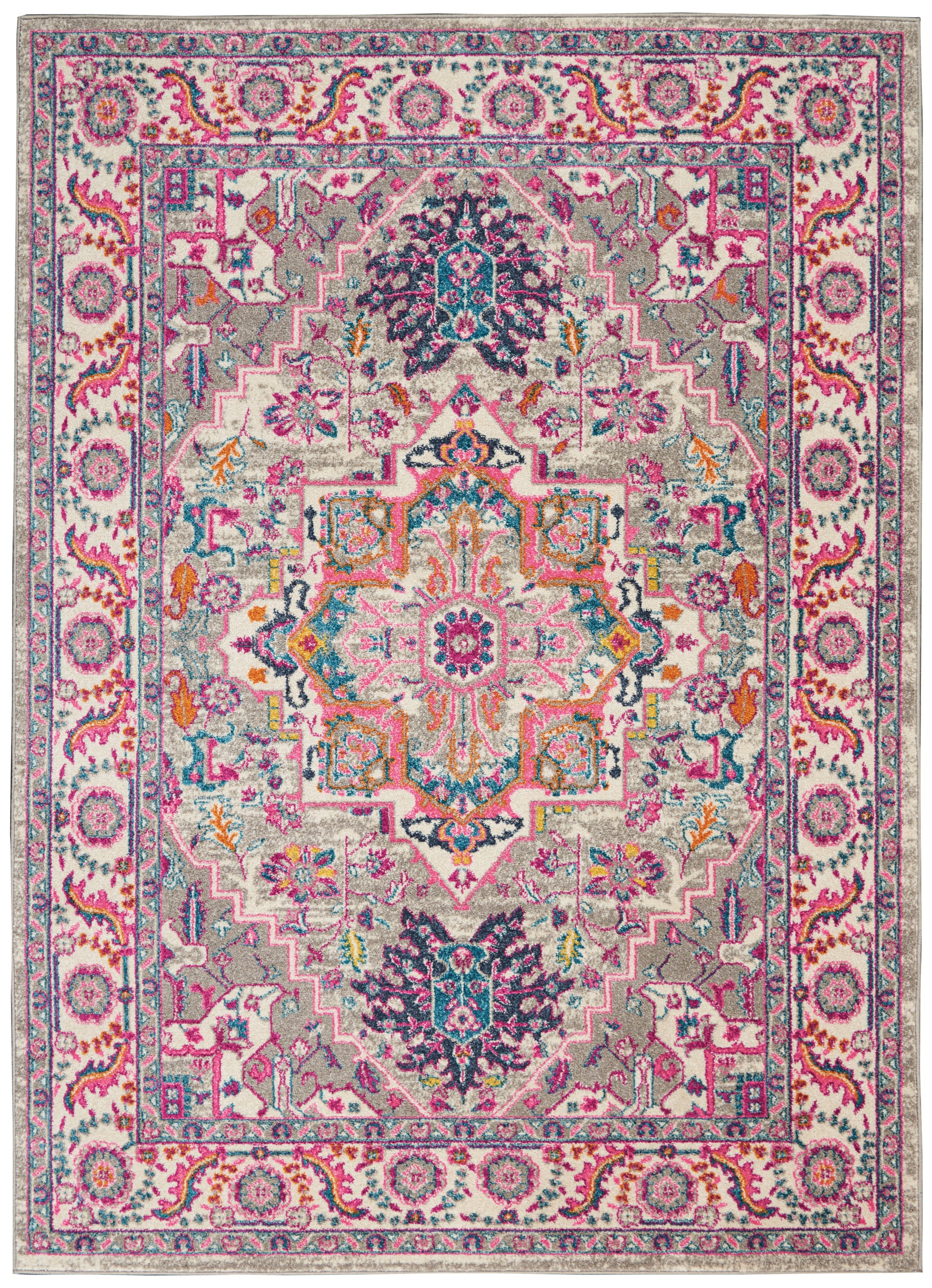 Colorful Bohemian-inspired area rug with pink, teal, navy and coral hues; central medallion, floral patterns, border.