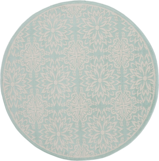 Round aqua rug with white intricate snowflake-mandala pattern and pale border.