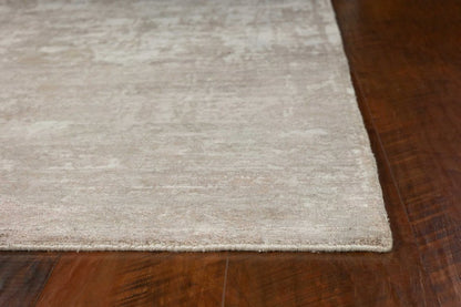7' X 10' Beige And Ivory Abstract Hand Loomed Area Rug