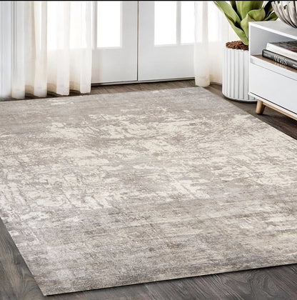 8' X 11' Beige And Ivory Abstract Hand Loomed Area Rug
