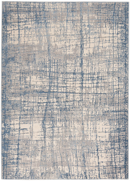 Blue and beige abstract area rug with distressed grid pattern; modern rectangular floor decor.