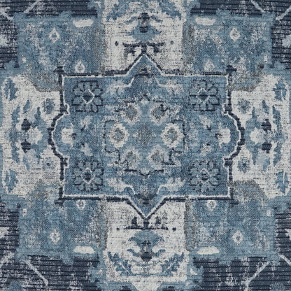 Blue distressed oriental pillow with a central medallion and floral motifs, 24" x 24