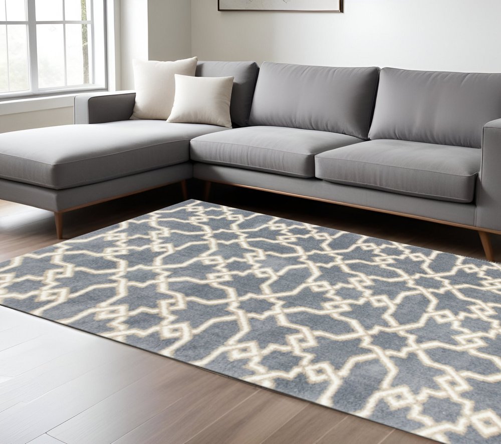 5' X 8' Slate Blue And Ivory Geometric Area Rug
