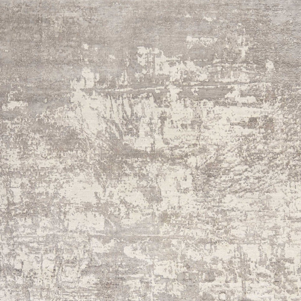 8' X 11' Beige And Ivory Abstract Hand Loomed Area Rug