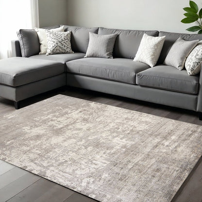 8' X 11' Beige And Ivory Abstract Hand Loomed Area Rug