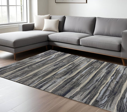 5' X 8' Gray Blue And Black Abstract Area Rug