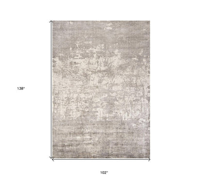 8' X 11' Beige And Ivory Abstract Hand Loomed Area Rug