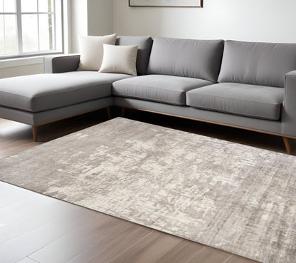 8' X 11' Beige And Ivory Abstract Hand Loomed Area Rug