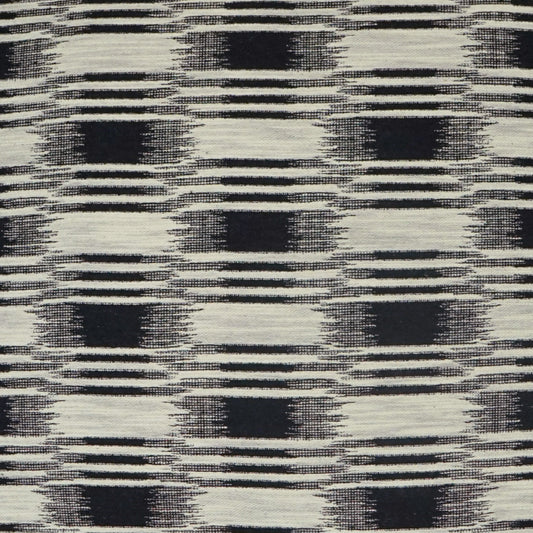 Black and ivory plaid fabric with a distressed, brush-like weave; bold check pattern for upholstery or apparel.