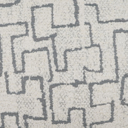 Grey pillow with a dark gray interlocking geometric square maze pattern.