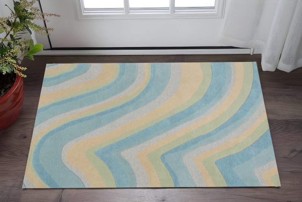 5' X 8' Blue Beige And Green Wool Abstract Hand Tufted Area Rug