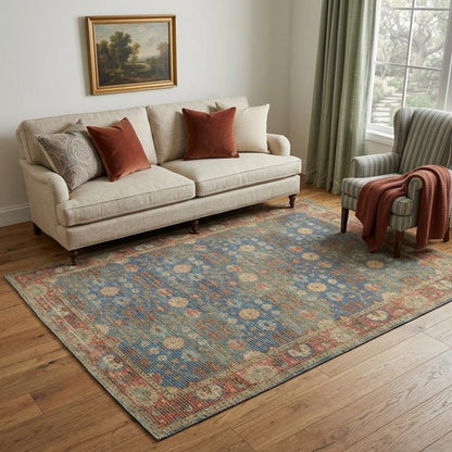 5' X 7' Blue Red And Beige Floral Medallion Hand Woven Distressed Area Rug