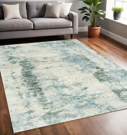 5' X 8' Ivory And Blue Abstract Area Rug