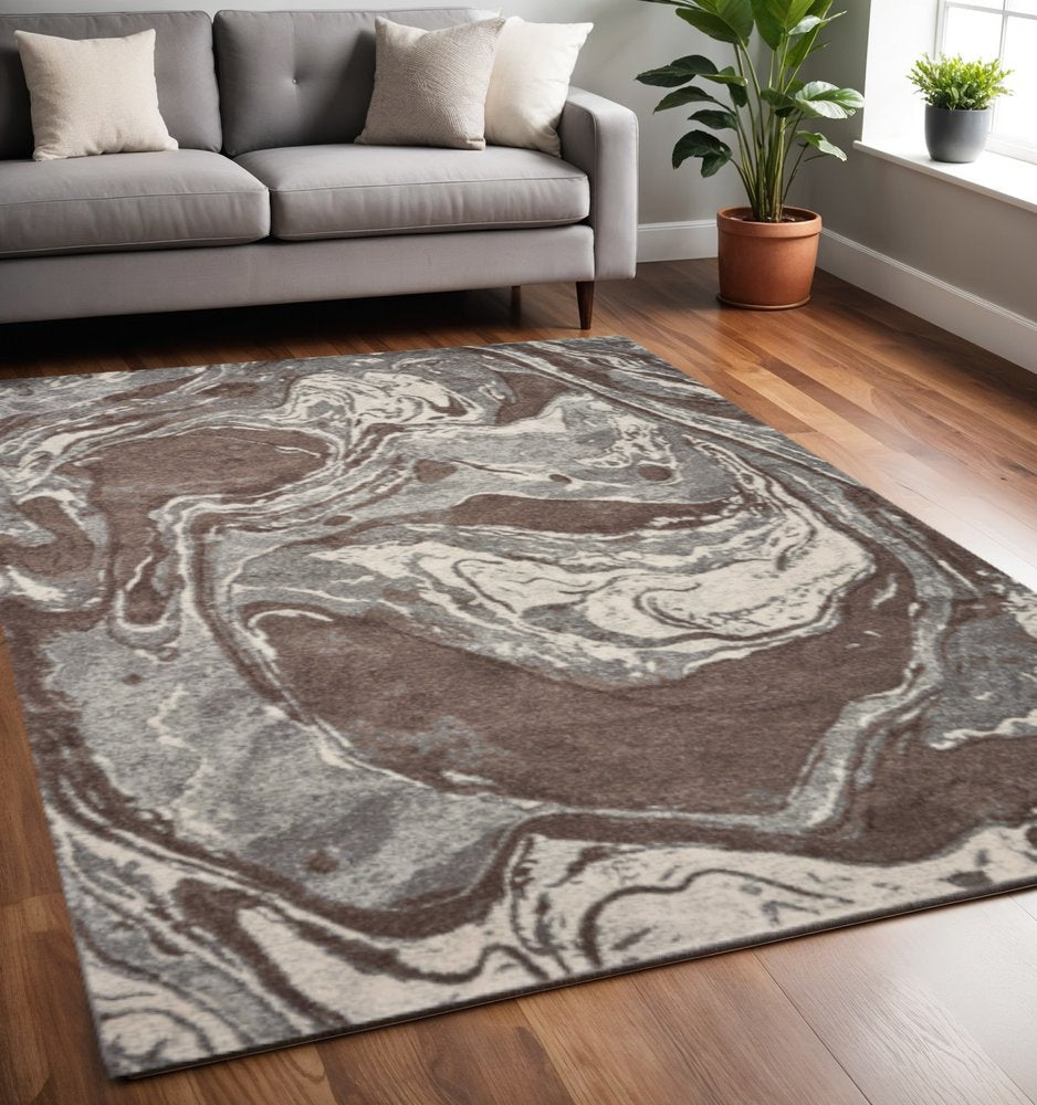 7' X 10' Brown And Ivory Abstract Area Rug