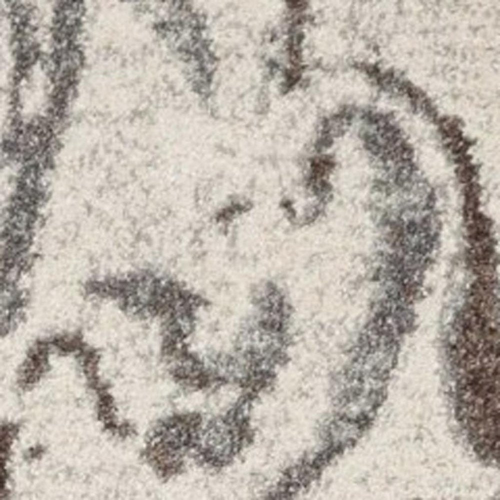 7' X 10' Brown And Ivory Abstract Area Rug