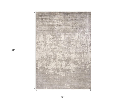 8' X 11' Beige And Ivory Abstract Hand Loomed Area Rug