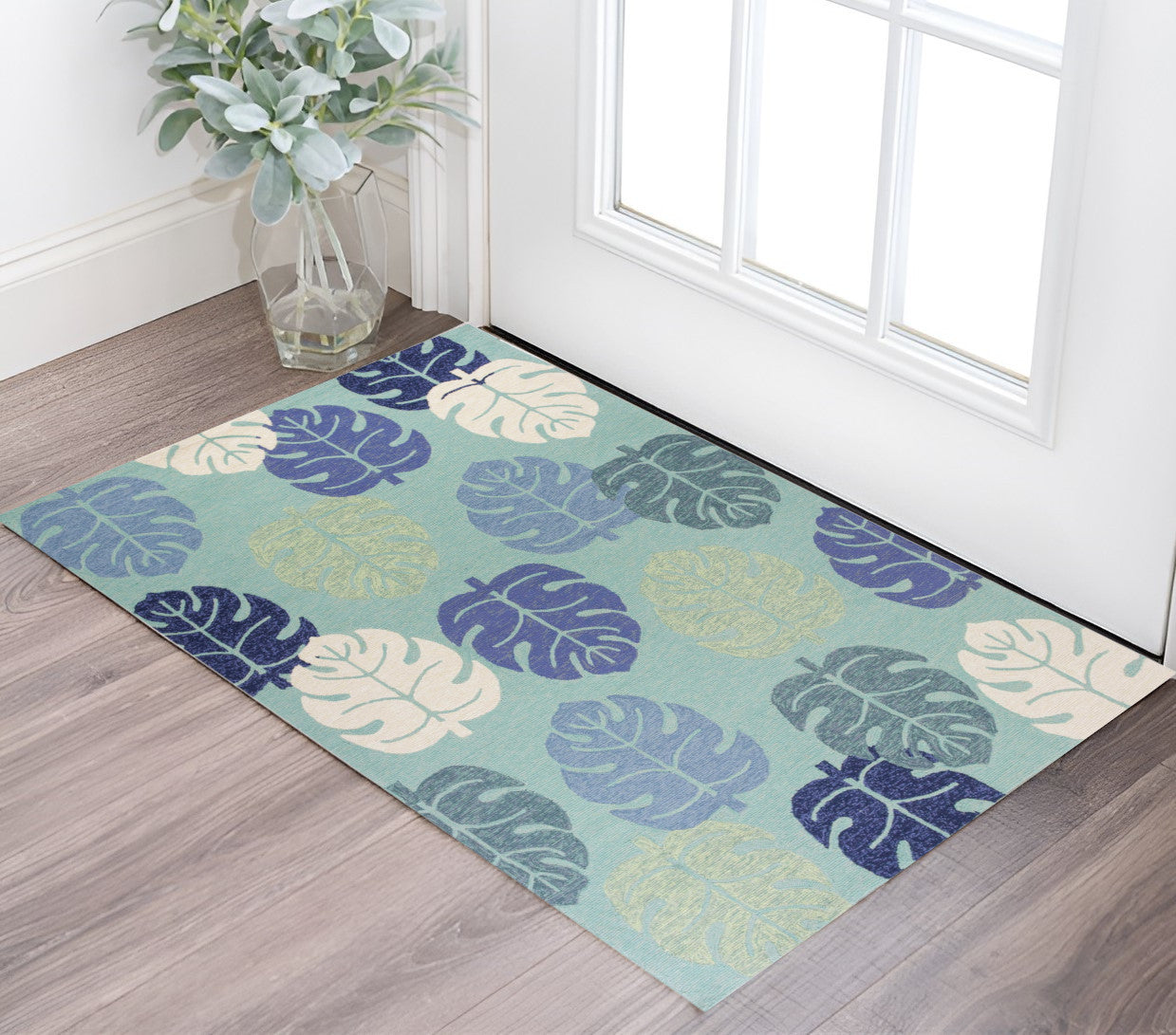 7' X 9' Turquoise And Ivory Botanical Leaves Hand Tufted Area Rug
