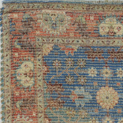 5' X 7' Blue Red And Beige Floral Medallion Hand Woven Distressed Area Rug