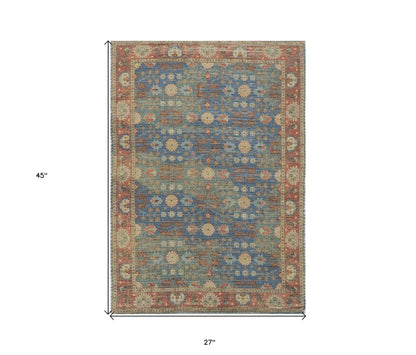 5' X 7' Blue Red And Beige Floral Medallion Hand Woven Distressed Area Rug