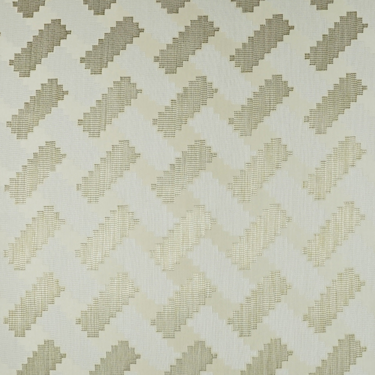 Beige and ivory fabric with repeating diagonal chevron blocks formed by tiny stitches.