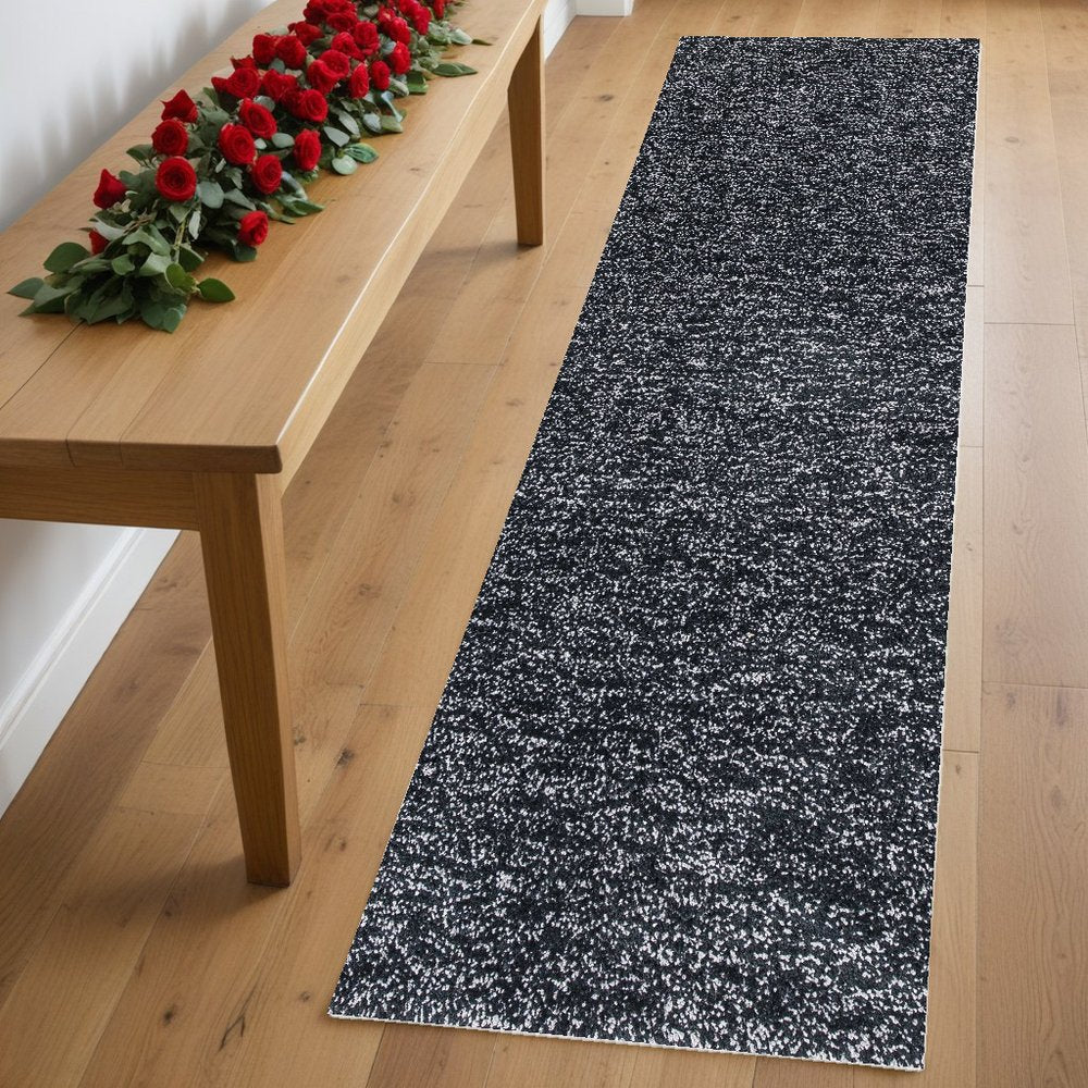 5' X 7' Black And White Shag Hand Woven Area Rug