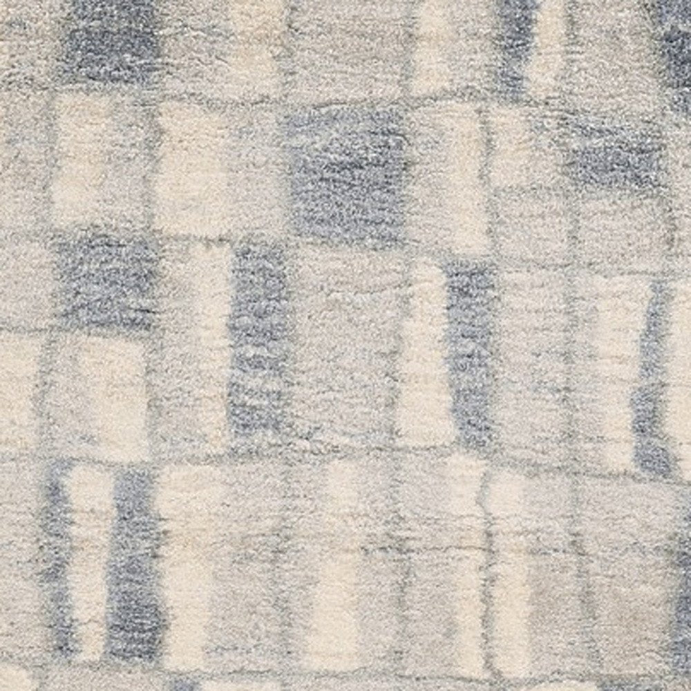 5' X 8' Ivory And Blue Abstract Area Rug