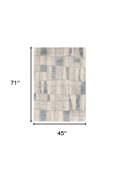 5' X 8' Ivory And Blue Abstract Area Rug