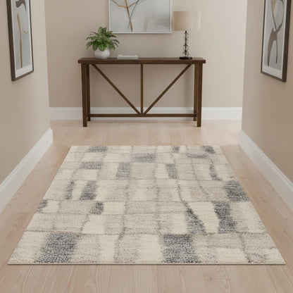 5' X 8' Ivory And Blue Abstract Area Rug