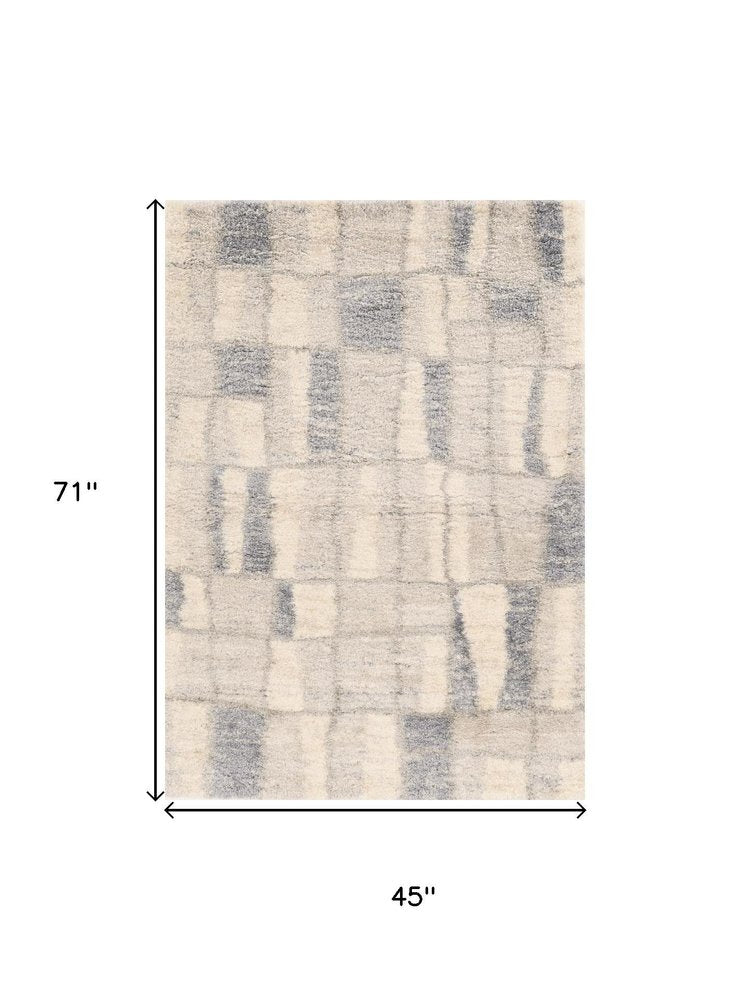 5' X 8' Ivory And Blue Abstract Area Rug