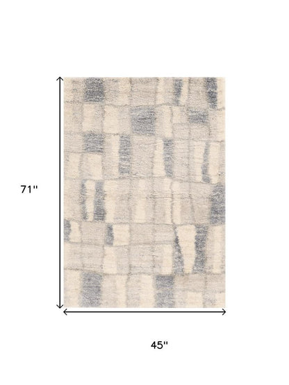 5' X 8' Ivory And Blue Abstract Area Rug