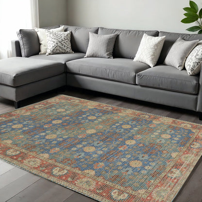 5' X 7' Blue Red And Beige Floral Medallion Hand Woven Distressed Area Rug