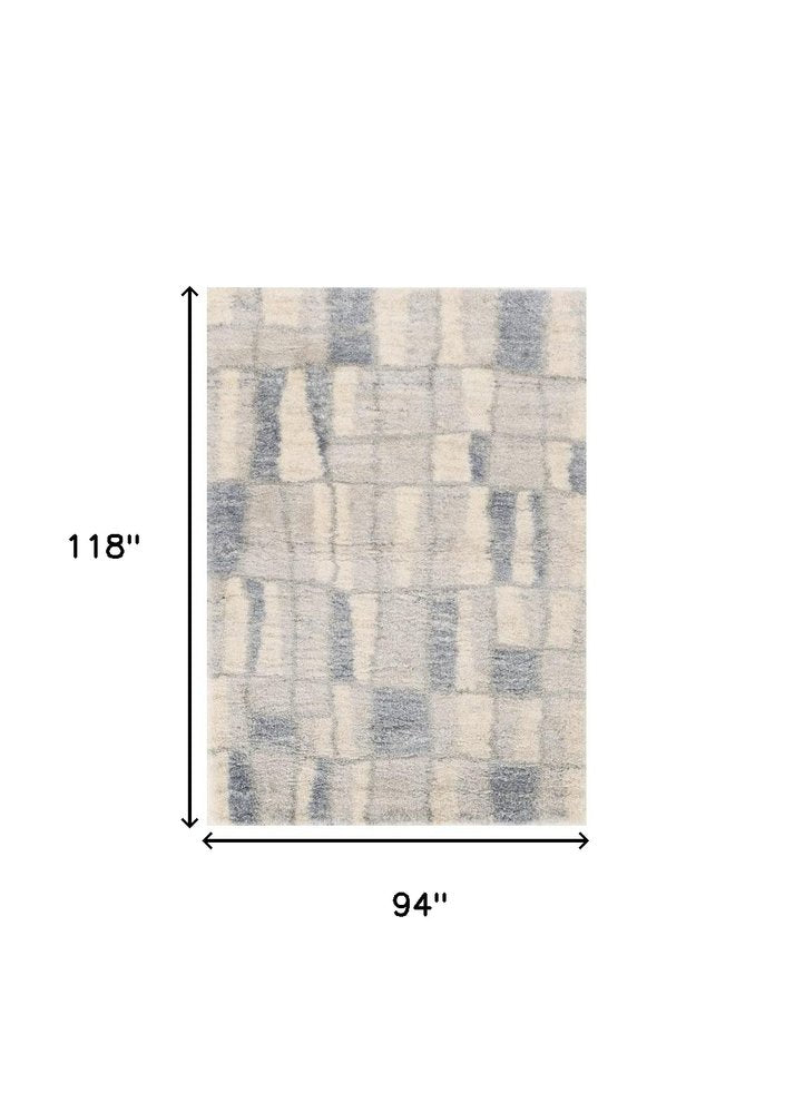 5' X 8' Ivory And Blue Abstract Area Rug