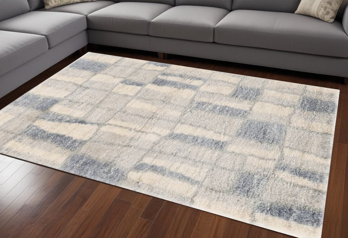 7' X 9' Ivory and Blue Area Rug